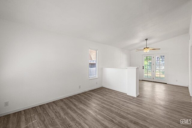 1224 N Mayflower Cir, Ridgecrest, CA 93555 - unfurnished room featuring ceiling fan, lofted ceiling, baseboards, and wood finished floors