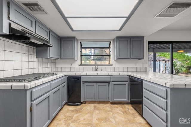 1224 N Mayflower Cir, Ridgecrest, CA 93555 - kitchen featuring under cabinet range hood, stainless steel gas cooktop, dishwasher, visible vents, and a sink