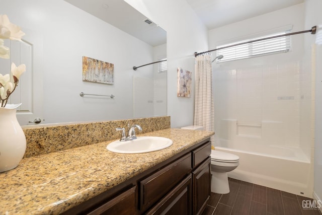 7714 Valle De Baztan Dr, Bakersfield, CA 93314 - bathroom with shower / tub combo with curtain, vanity, and toilet