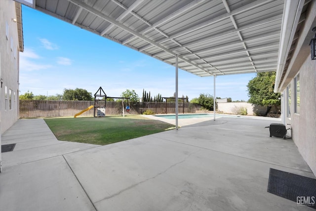10318 Roehampton Ave, Bakersfield, CA 93312 - fenced backyard with a playground and a patio area