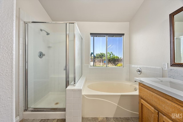10318 Roehampton Ave, Bakersfield, CA 93312 - full bathroom featuring a bath, vanity, and a shower stall