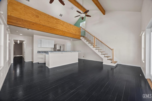 10318 Roehampton Ave, Bakersfield, CA 93312 - unfurnished living room with a ceiling fan, high vaulted ceiling, stairway, beam ceiling, and dark wood finished floors