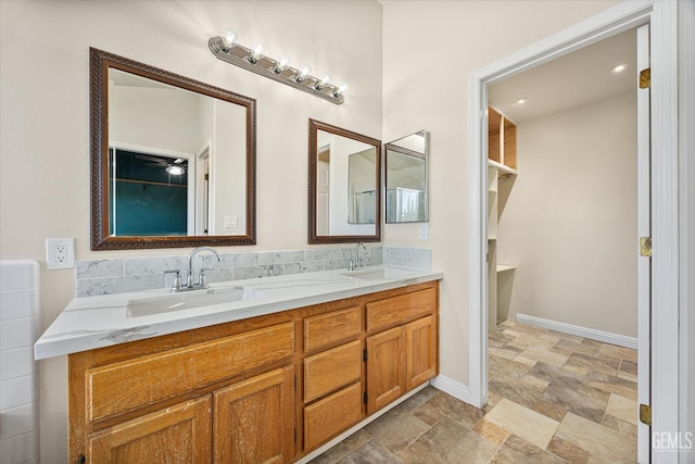 10318 Roehampton Ave, Bakersfield, CA 93312 - full bath featuring stone finish flooring and double vanity