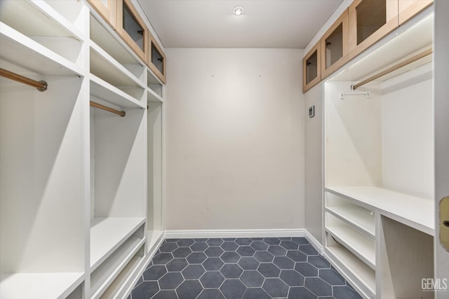 10318 Roehampton Ave, Bakersfield, CA 93312 - walk in closet with dark tile patterned floors