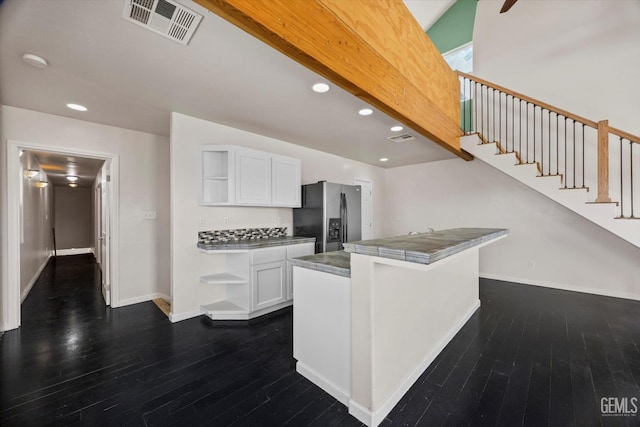 10318 Roehampton Ave, Bakersfield, CA 93312 - kitchen with stainless steel fridge, open shelves, white cabinets, dark wood-type flooring, and recessed lighting