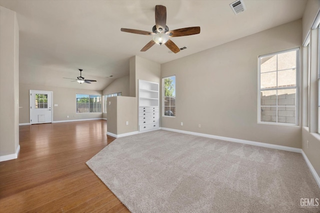 10318 Roehampton Ave, Bakersfield, CA 93312 - unfurnished living room featuring ceiling fan, wood finished floors, and lofted ceiling