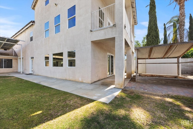 10318 Roehampton Ave, Bakersfield, CA 93312 - back of house with stucco siding and a patio area