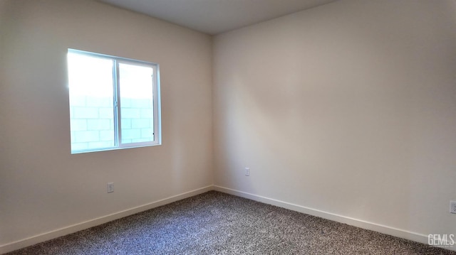 12801 Kinnick Ct, Bakersfield, CA 93311 - empty room with dark carpet and baseboards