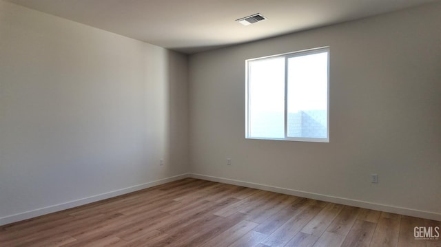 12801 Kinnick Ct, Bakersfield, CA 93311 - unfurnished room with light wood-style flooring and baseboards