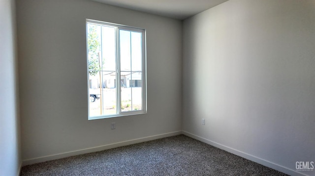 12801 Kinnick Ct, Bakersfield, CA 93311 - spare room with healthy amount of natural light and carpet flooring