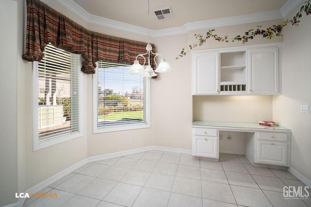 interior space with crown molding, built in desk, and light tile patterned floors