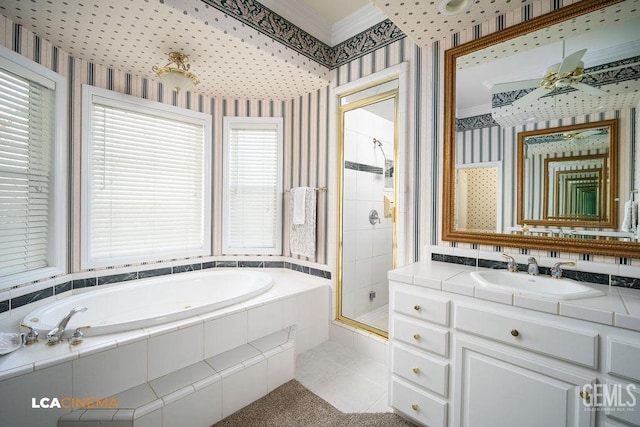 bathroom with crown molding, vanity, and independent shower and bath