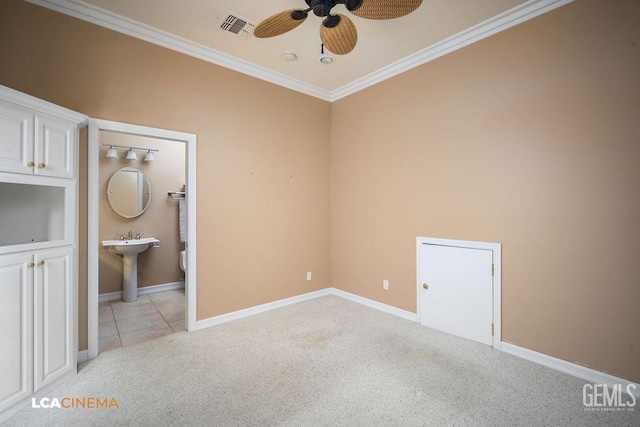 spare room with crown molding, sink, light carpet, and ceiling fan