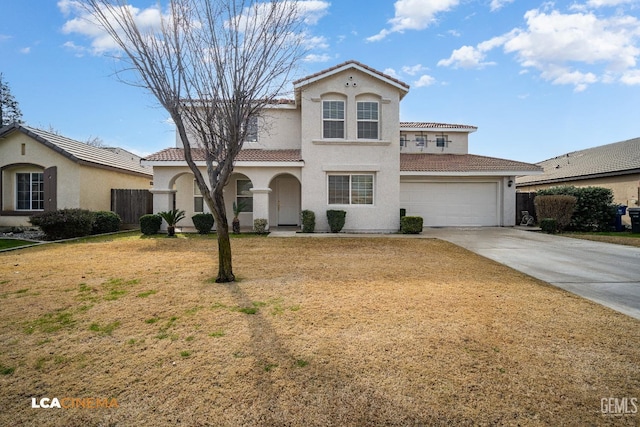 mediterranean / spanish house with a garage and a front yard