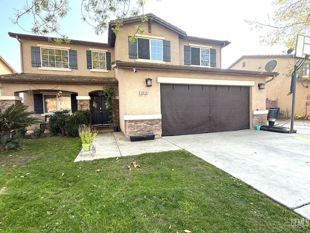 view of front of property with a front yard and a garage