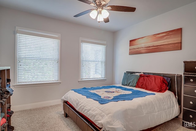 bedroom featuring ceiling fan and baseboards