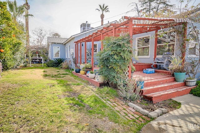 view of yard with a deck and a pergola