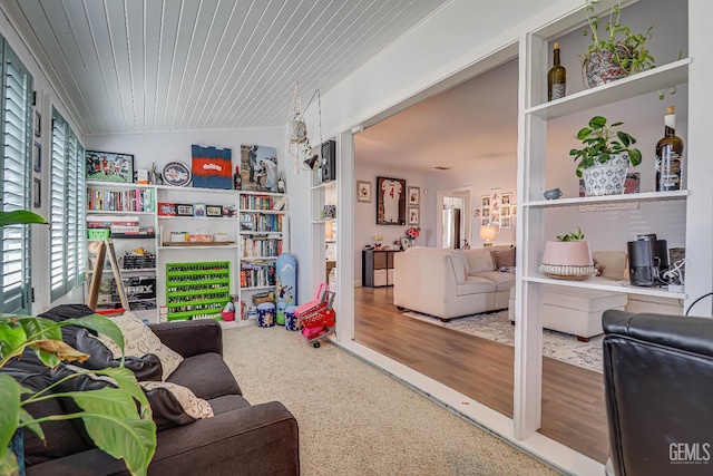 game room featuring lofted ceiling, wood finished floors, and wood ceiling