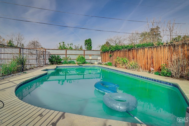 view of pool with a fenced backyard and a fenced in pool