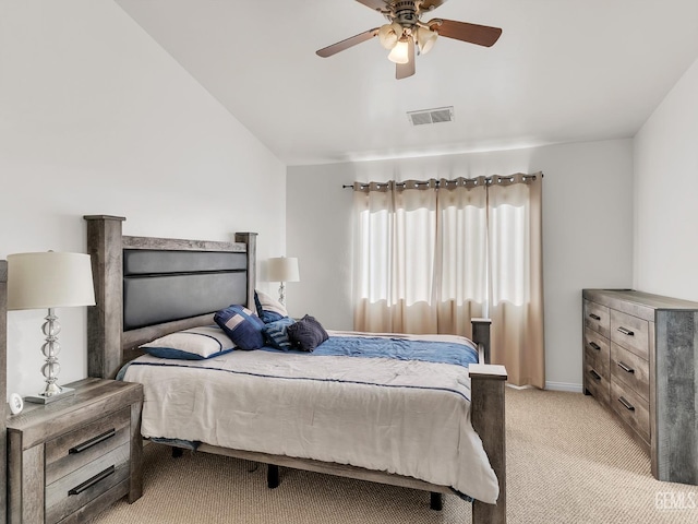 bedroom featuring lofted ceiling, light colored carpet, visible vents, ceiling fan, and baseboards