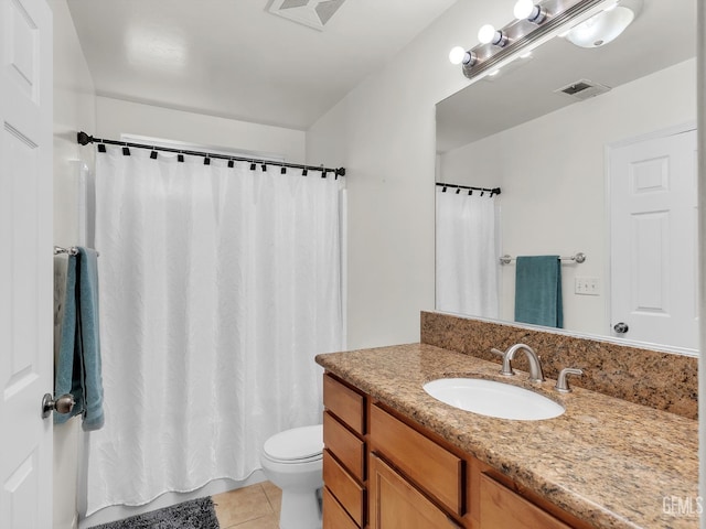 bathroom featuring tile patterned floors, visible vents, toilet, and vanity