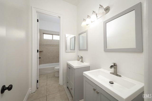 5507 Via Venezia, Bakersfield, CA 93306 - bathroom with two vanities, tile patterned floors, toilet, and bathing tub / shower combination