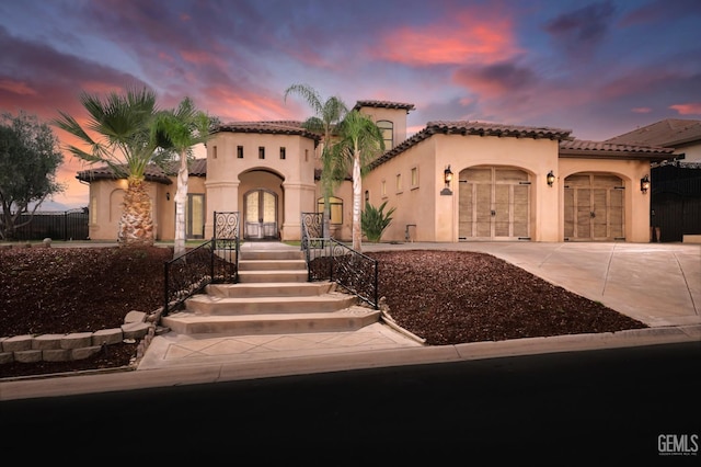 5507 Via Venezia, Bakersfield, CA 93306 - mediterranean / spanish home with stucco siding, concrete driveway, a garage, and french doors