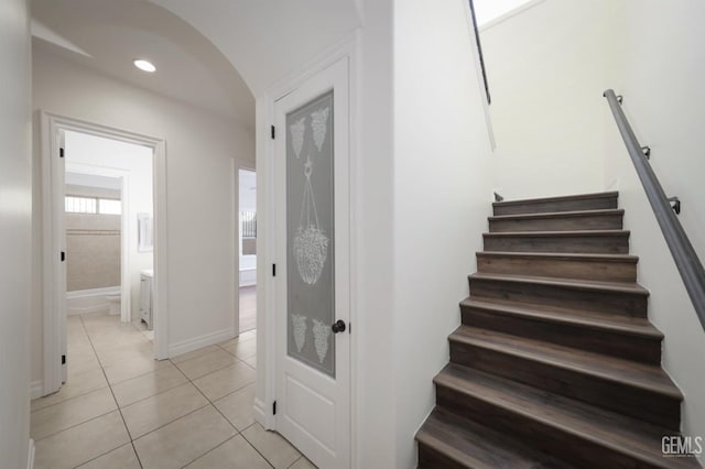 5507 Via Venezia, Bakersfield, CA 93306 - staircase with arched walkways, tile patterned floors, baseboards, and recessed lighting