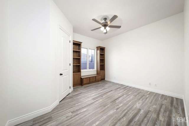 5507 Via Venezia, Bakersfield, CA 93306 - unfurnished room with light wood-type flooring, a ceiling fan, and baseboards