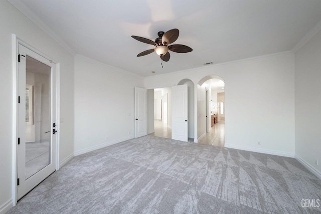 5507 Via Venezia, Bakersfield, CA 93306 - unfurnished bedroom with arched walkways, light carpet, ornamental molding, and baseboards