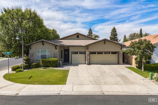 9310 Via Catania, Bakersfield, CA 93312 - ranch-style house with driveway, stone siding, an attached garage, stucco siding, and a front lawn