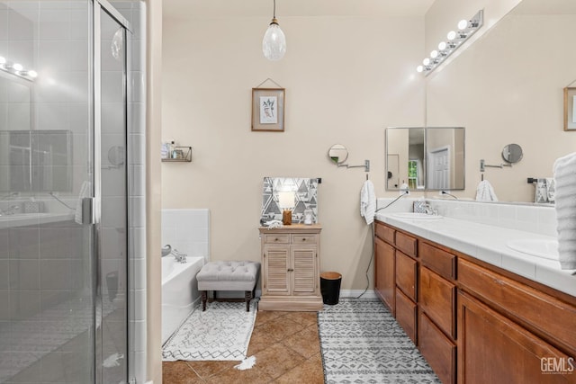 9310 Via Catania, Bakersfield, CA 93312 - full bathroom with double vanity, a bathing tub, a stall shower, and a sink