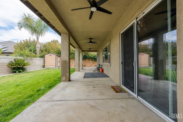 9310 Via Catania, Bakersfield, CA 93312 - view of patio / terrace with an outbuilding, a ceiling fan, a storage unit, and a fenced backyard