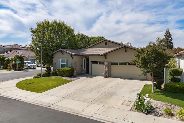 9310 Via Catania, Bakersfield, CA 93312 - ranch-style home featuring a garage, a front lawn, stucco siding, and a tiled roof