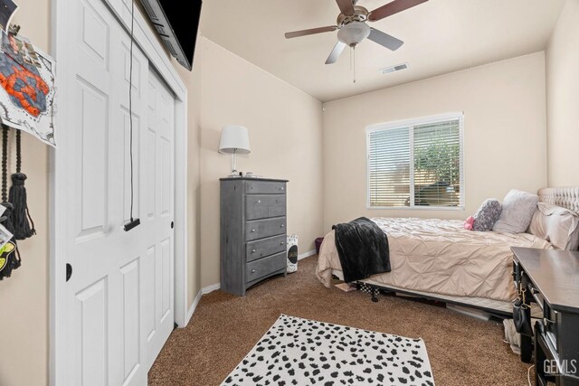 9310 Via Catania, Bakersfield, CA 93312 - bedroom with a closet, a ceiling fan, visible vents, dark colored carpet, and baseboards
