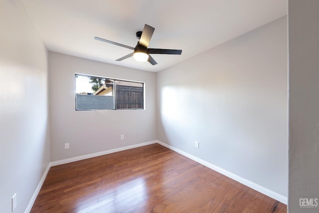 2800 S Real Rd, Bakersfield, CA 93309 - unfurnished room with wood finished floors, ceiling fan, and baseboards
