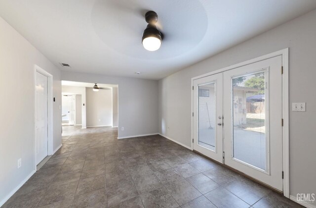 2800 S Real Rd, Bakersfield, CA 93309 - unfurnished room featuring french doors, baseboards, and a ceiling fan