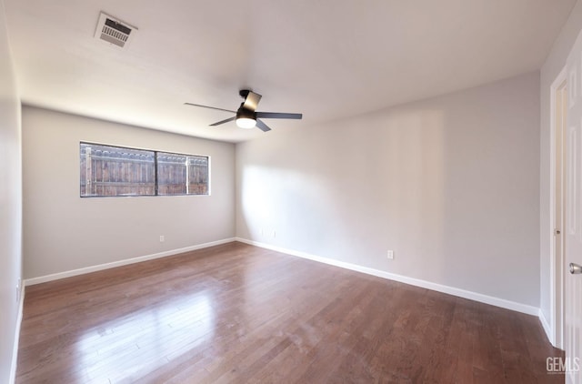 2800 S Real Rd, Bakersfield, CA 93309 - empty room with a ceiling fan, dark wood finished floors, and baseboards