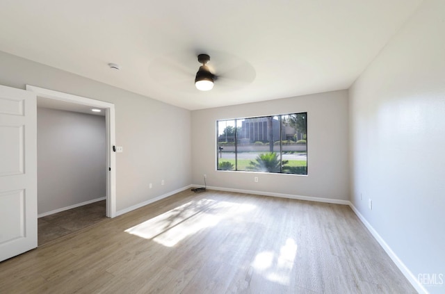 2800 S Real Rd, Bakersfield, CA 93309 - empty room with a ceiling fan, wood finished floors, baseboards, and a smoke detector
