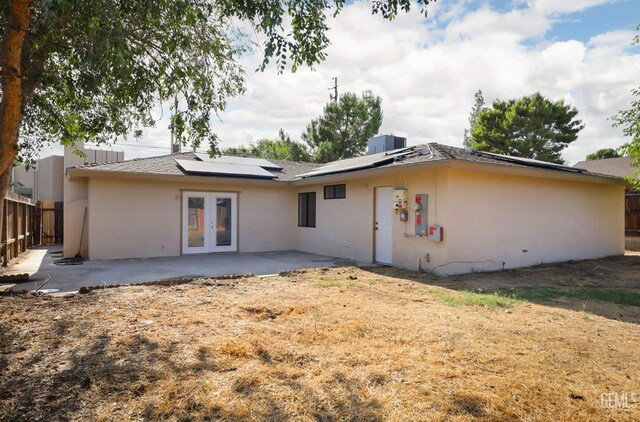 2800 S Real Rd, Bakersfield, CA 93309 - back of property featuring french doors, stucco siding, a patio area, and solar panels