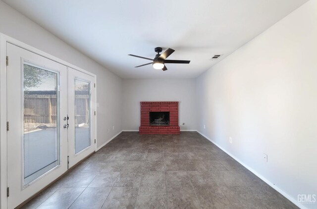 2800 S Real Rd, Bakersfield, CA 93309 - unfurnished living room with french doors, ceiling fan, baseboards, and a fireplace