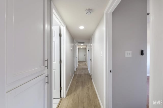 2800 S Real Rd, Bakersfield, CA 93309 - hall featuring light wood-style floors, baseboards, and recessed lighting