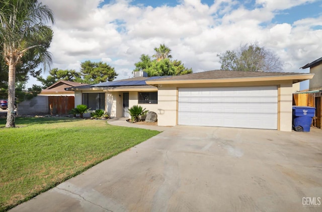 2800 S Real Rd, Bakersfield, CA 93309 - single story home with stucco siding, driveway, roof mounted solar panels, and a garage