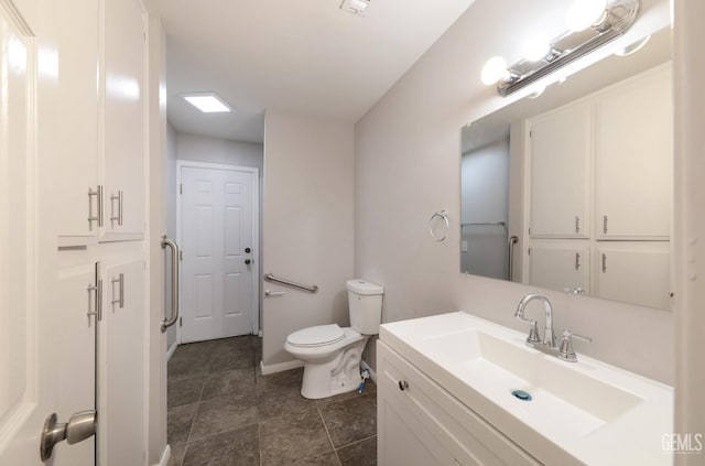 2800 S Real Rd, Bakersfield, CA 93309 - bathroom with toilet, vanity, tile patterned flooring, and baseboards