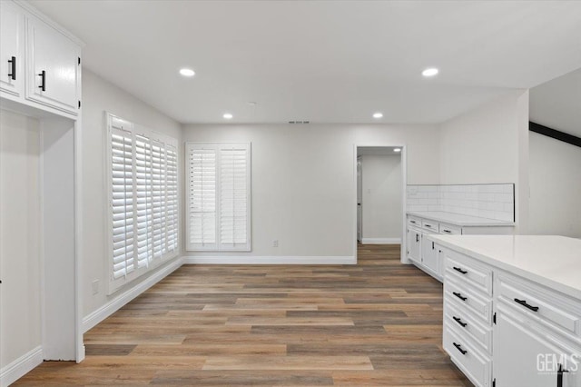 5100 Ruth Ct, Bakersfield, CA 93308 - kitchen featuring recessed lighting, light wood-type flooring, white cabinets, and light countertops