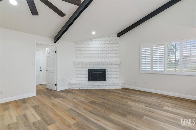 5100 Ruth Ct, Bakersfield, CA 93308 - unfurnished living room featuring ceiling fan, light wood-style flooring, a brick fireplace, and recessed lighting