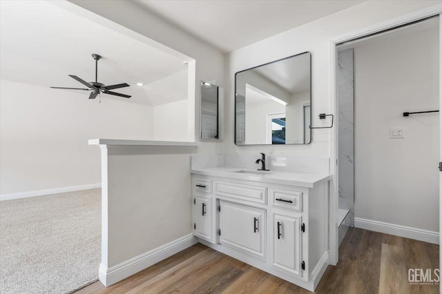 5100 Ruth Ct, Bakersfield, CA 93308 - bathroom with vanity, a ceiling fan, and wood finished floors