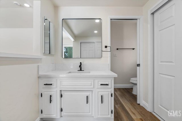 5100 Ruth Ct, Bakersfield, CA 93308 - bathroom featuring vanity, wood finished floors, and recessed lighting
