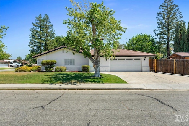 5100 Ruth Ct, Bakersfield, CA 93308 - single story home with an attached garage, driveway, brick siding, a tiled roof, and stucco siding