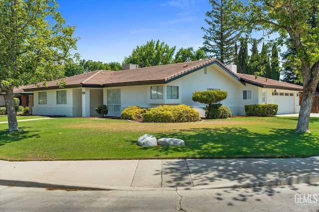5100 Ruth Ct, Bakersfield, CA 93308 - ranch-style home with an attached garage, a front yard, driveway, stucco siding, and a tiled roof